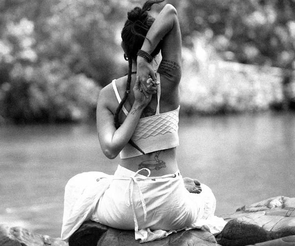 Person in a meditative yoga pose, symbolizing inner peace and balance.